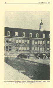 Black and white photo of a large brick building with a cupola and dormer windows, flanked by leafless trees and parked cars. The building is identified as a former war surplus barracks added to the BCC Campus in 1947.