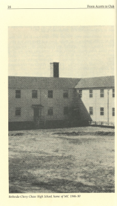 Black and white photo of the original Bethesda-Chevy Chase High School building, which housed Montgomery College from 1946 to 1950. The image shows a plain, two-story brick structure with a central chimney and minimal landscaping in the foreground.