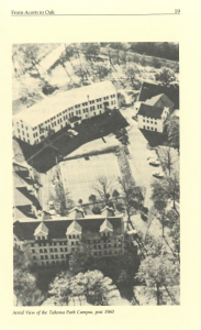 Aerial black and white photograph of Montgomery College’s Takoma Park Campus taken after 1960. Several large academic buildings are visible, along with a tennis court at the center of the campus, surrounded by mature trees and adjacent roadways.