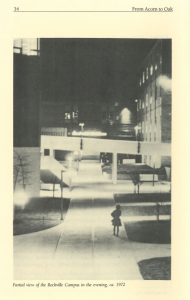 Black and white nighttime photo showing a partially lit walkway at Montgomery College's Rockville Campus. A solitary figure stands in the foreground while the background reveals campus buildings and elevated walkways illuminated by streetlights.