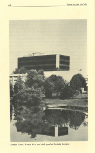 Black and white image showing the Campus Tower and Science West buildings at Montgomery College’s Rockville Campus, with a tree-lined duck pond in the foreground reflecting the scene.