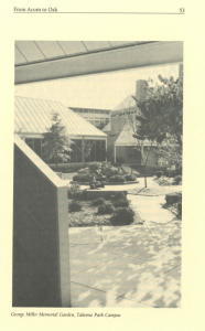 Black and white image of the George Miller Memorial Garden on the Takoma Park Campus, showing landscaped flowerbeds, trees, and geometric buildings in the background, viewed from a shaded patio area.