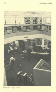 Black and white image showing a two-level view of the Germantown Campus Library. The lower floor features a service desk, book return area, and patrons, while the upper floor has bookshelves and study spaces near large windows.