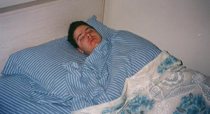A person lying in bed